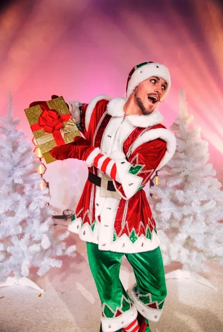 Festive costumed performer with gift boxes at a New Year party in Dubai produced by EFT Entertainment Group